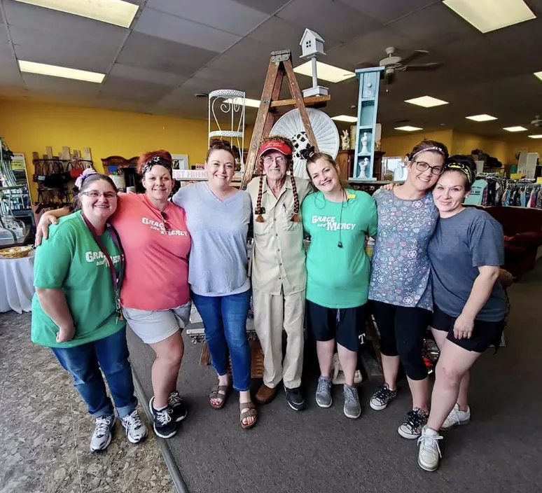 The Grace & Mercy team gathered together at the Thrift store